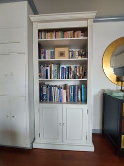 84 x 37 x 15 inches.
Beautiful solid wood white bookcase with doors.
