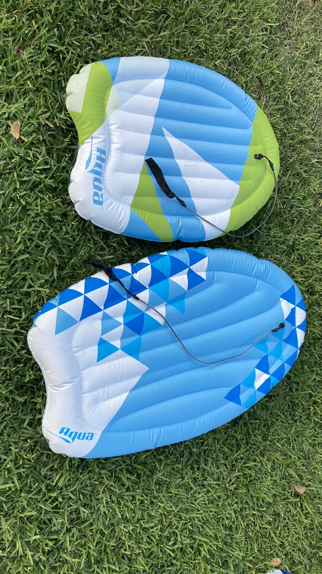 inflatable boogie board that comes w/a leash—by Aqua Leisure—2 different sizes