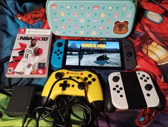 Nintendo switch oled console with two games, $180