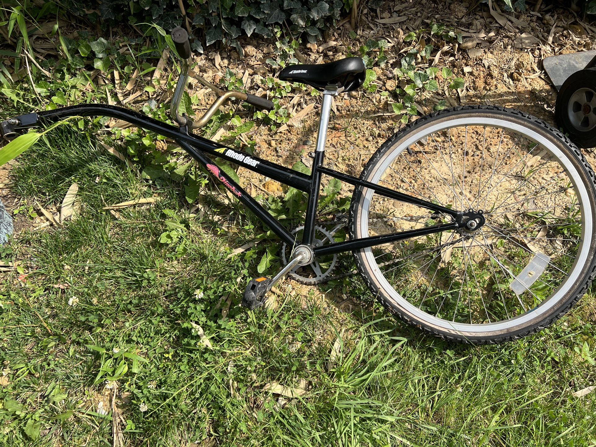 Rhode Gear Dinobak trail-a-bike. Attaches to your bike to allow your kid to ride with you.