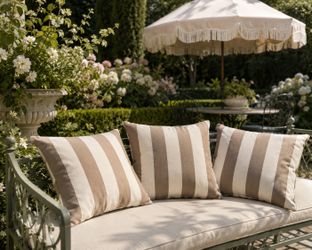 Three striped outdoor patio pillows