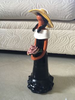 Ceramic lady with flower from Santo Domingo 13 1/2” H x 5” W