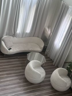 curved sofa with 2 swivel chairs