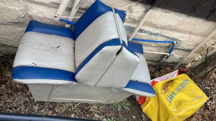 Boat seats and swivel captain chair. Bag of life jackets included