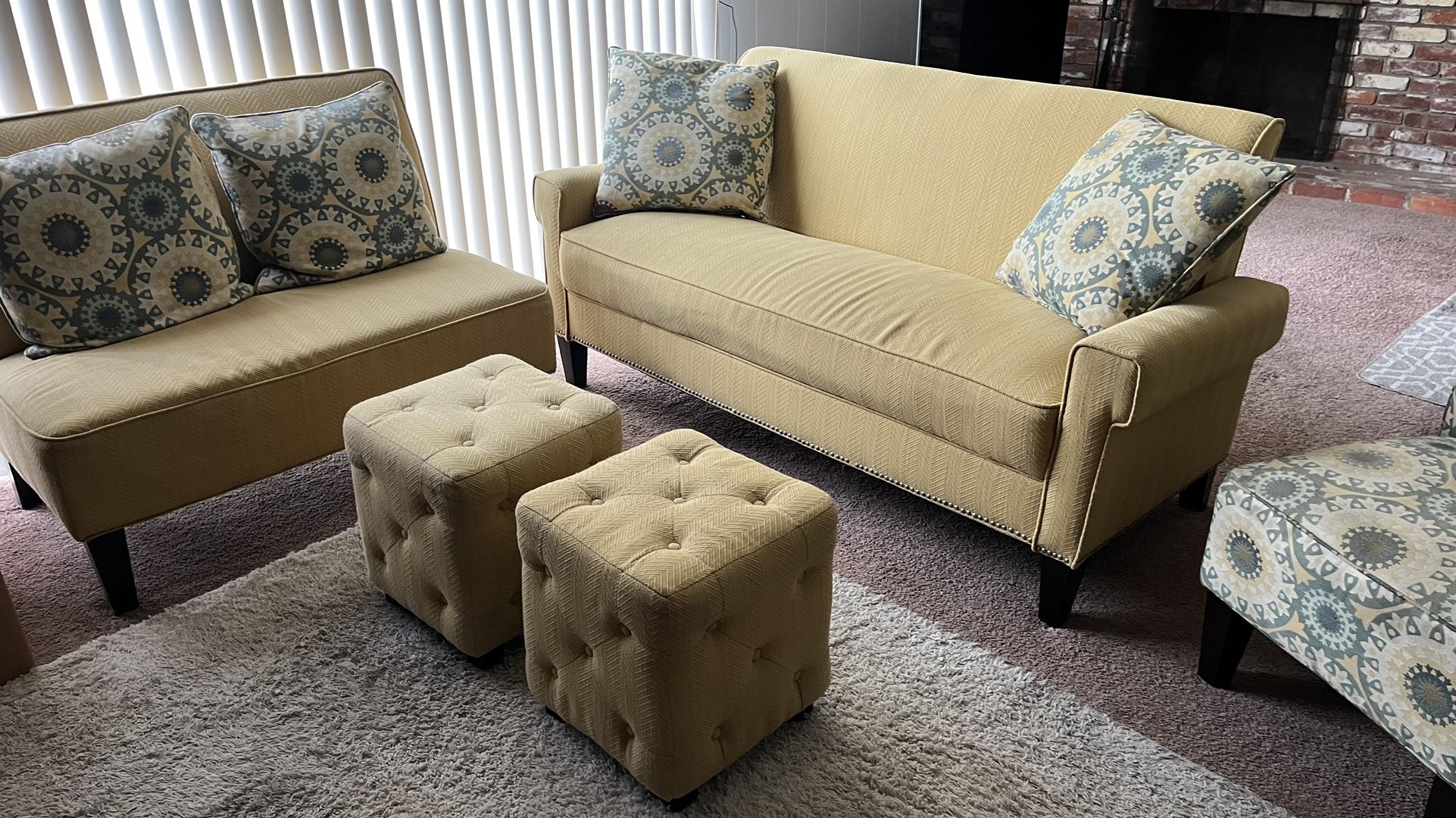 Living room Couch, Love Seat, Chair, and Ottomans. 