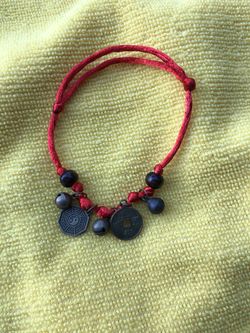 Chinese Fengshui lucky charms bracelet with red color .
