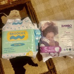 Two Packs Of  Diapers Size 5 Open Box