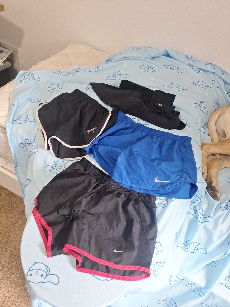 Women's RUNNING shorts LOT 4 pair Nike And DCG Sizes S, M, AND L