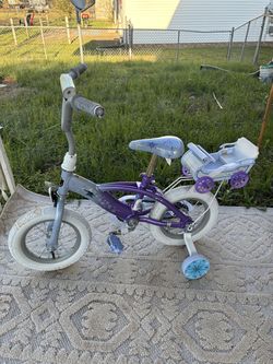 *WILL TRADE* Huffy Disney Frozen Kids' Bicycle featuring 12-inch wheels and a detachable doll carrier sleigh