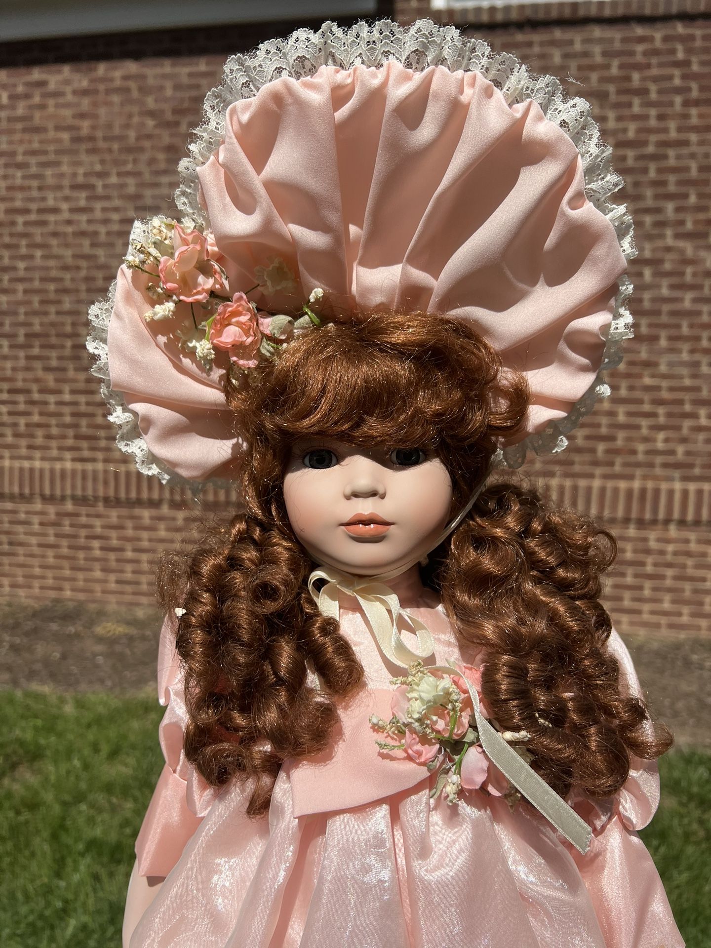 Vintage American Classics Cracker Barrel Collection 23” Porcelain Doll "Wendy" Measurements are approximate. A rosette is on one shoe only. Non-smo