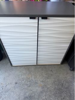 Gray and white cabinet