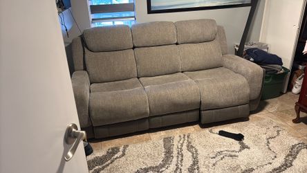 Jeromes couch with electric recliner