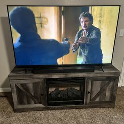 LG QNED 65” TV and TV console with electrical Fireplace