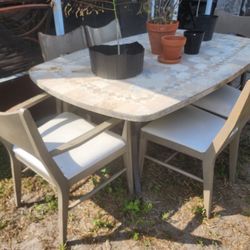 Granite Table And Wooden Chairs 