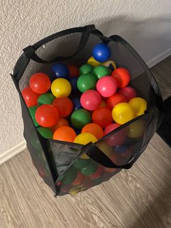 Laundry basket full of kids’ play balls 🟡🔵🔴