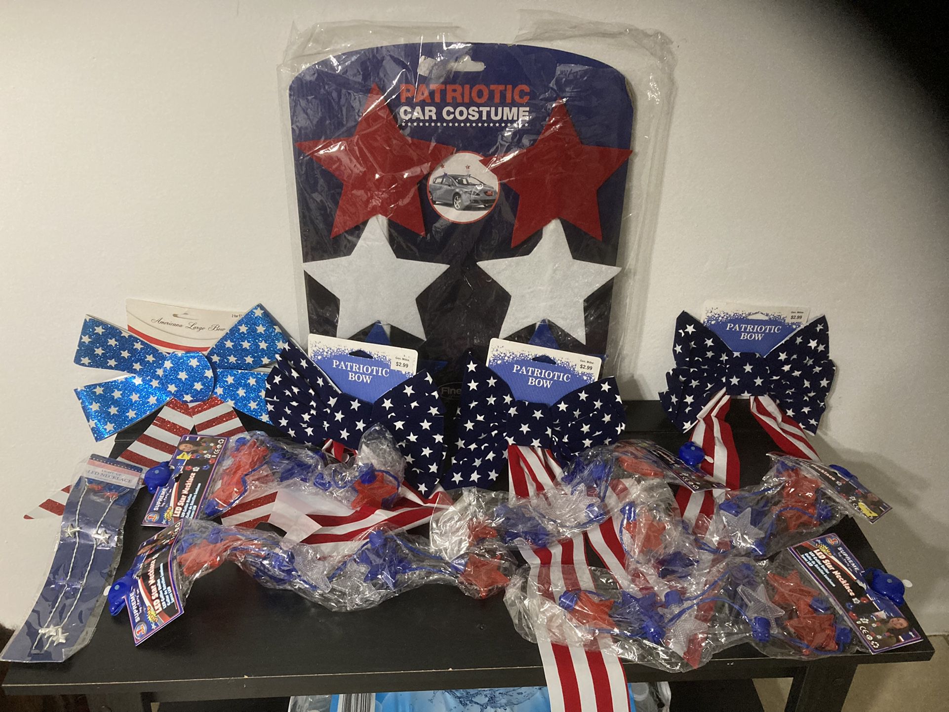 Patriotic car decoration, bows, and light up star necklaces