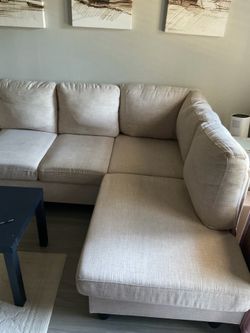 Lightly used beige sectional couch