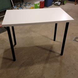 White Table with Black Pole Legs