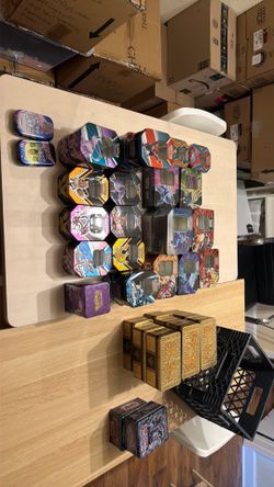 Empty Pokemon and yugioh tins