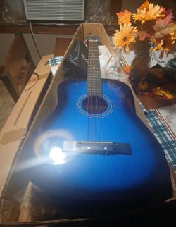 Vibrant blue acoustic guitar