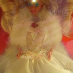 This is a 1989 Happy Holidays Special Edition Barbie doll by Mattel. 