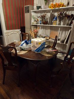 Oak dining room table and four chairs