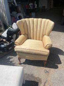 channel back wing chair with carved mahogany legs