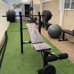 Gym Equipmentt bench press with 100lb weight set Combo With leg extension