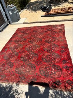 Distressed, antique tribal rug