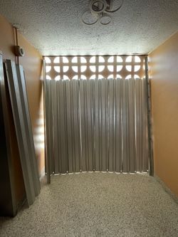 Aluminum Panel Hurricane Shutters and H-Header