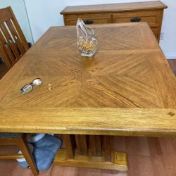 Oak dining room table  and six chairs
