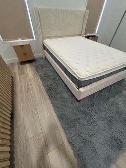 Queen size Cream Upholstered Bed Frame with Wingback Headboard with mattress and two nightstands and dresser