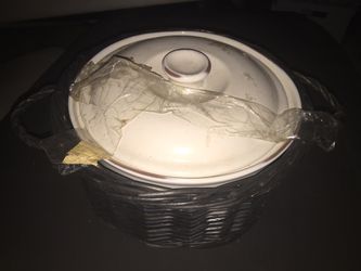Ceramics pot in wicker basket