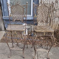 Beautiful pair of vintage heavy wrought iron bar stools.