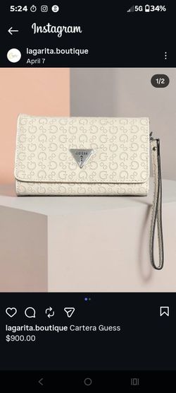 Brand New beige Guess wallet featuring a flap closure and triangular metal logo plaque.