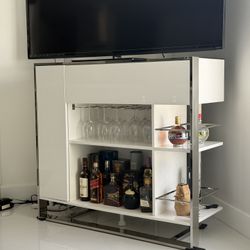 Home Decor / White Bar, Stainless Steel Frame. Dimensions: 23W x 50L x 46H Was $2,300