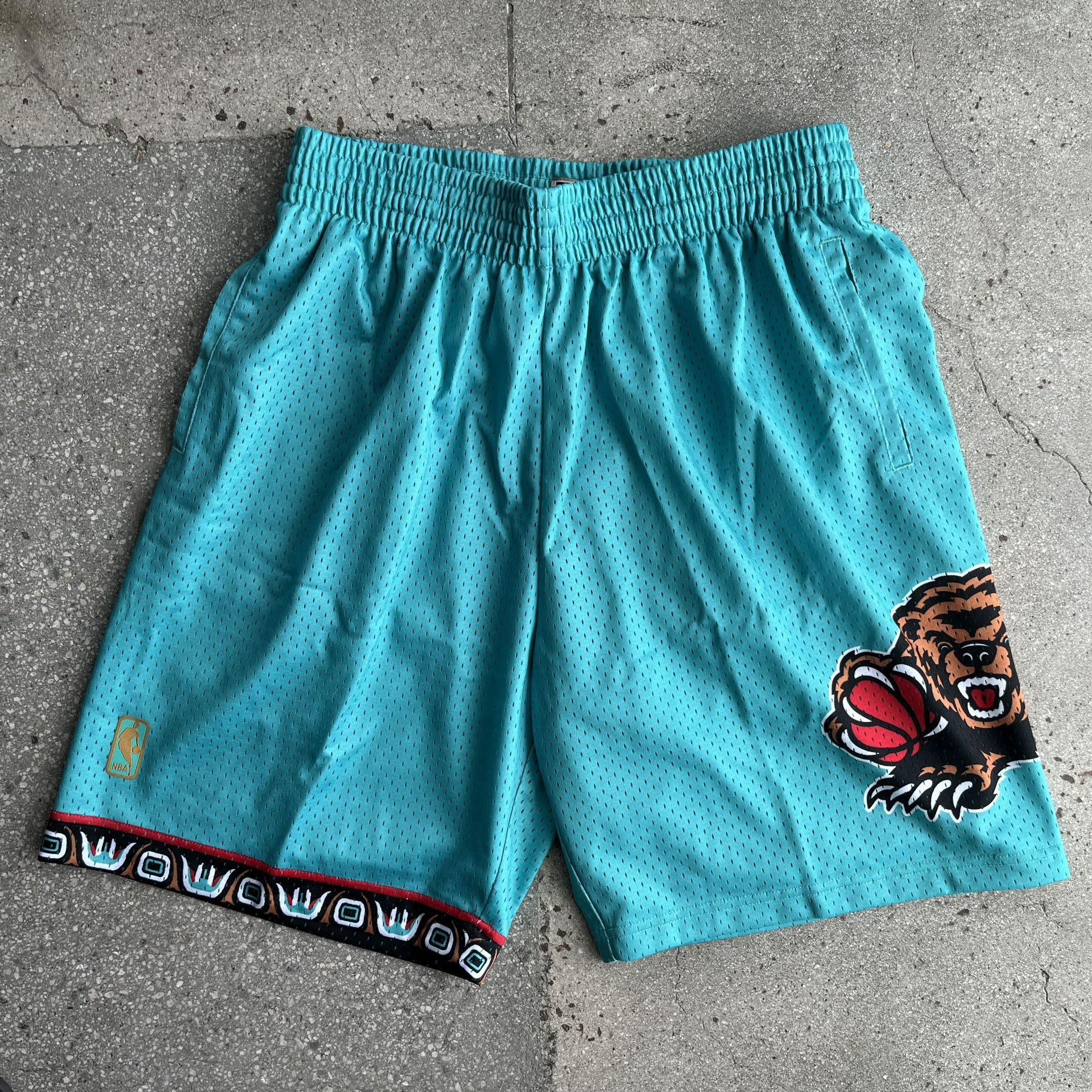 Shop Mitchell & Ness Vancouver Grizzlies 1996 Road Swingman Shorts  SMSHGS18259-VGRTEAL96 blue