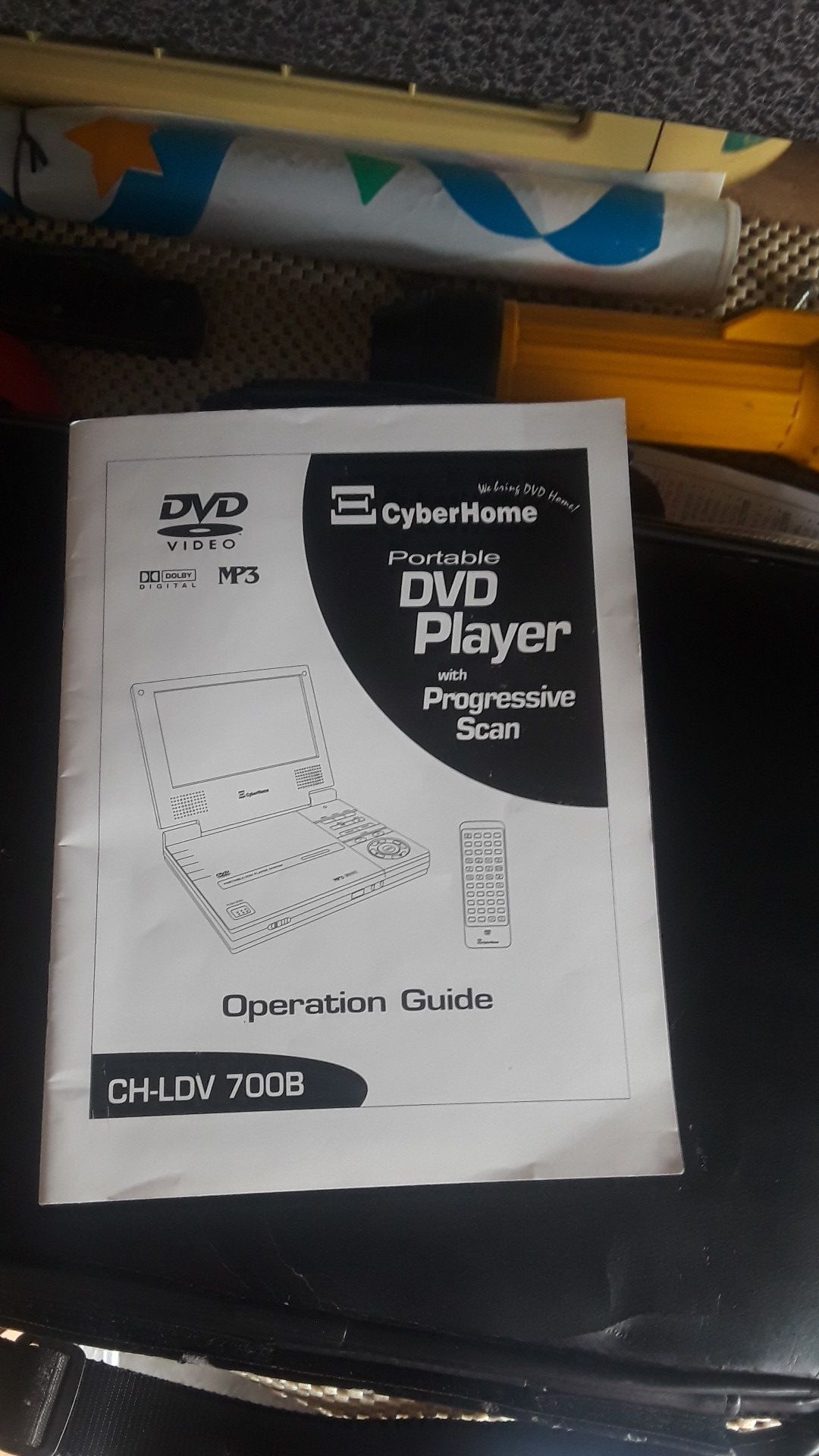 Portable DVD player with case and booklet