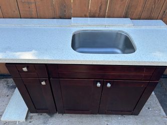 Cabinet with sink and quartz countertops