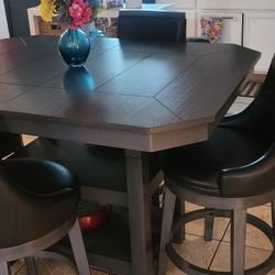 Sold Wood Table With Swivel 4 Leather Chairs