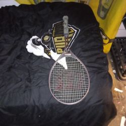 Is,, A Wilson Tennis Racket Black An Gray,,. 