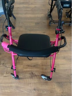 Bright pink walker with brakes