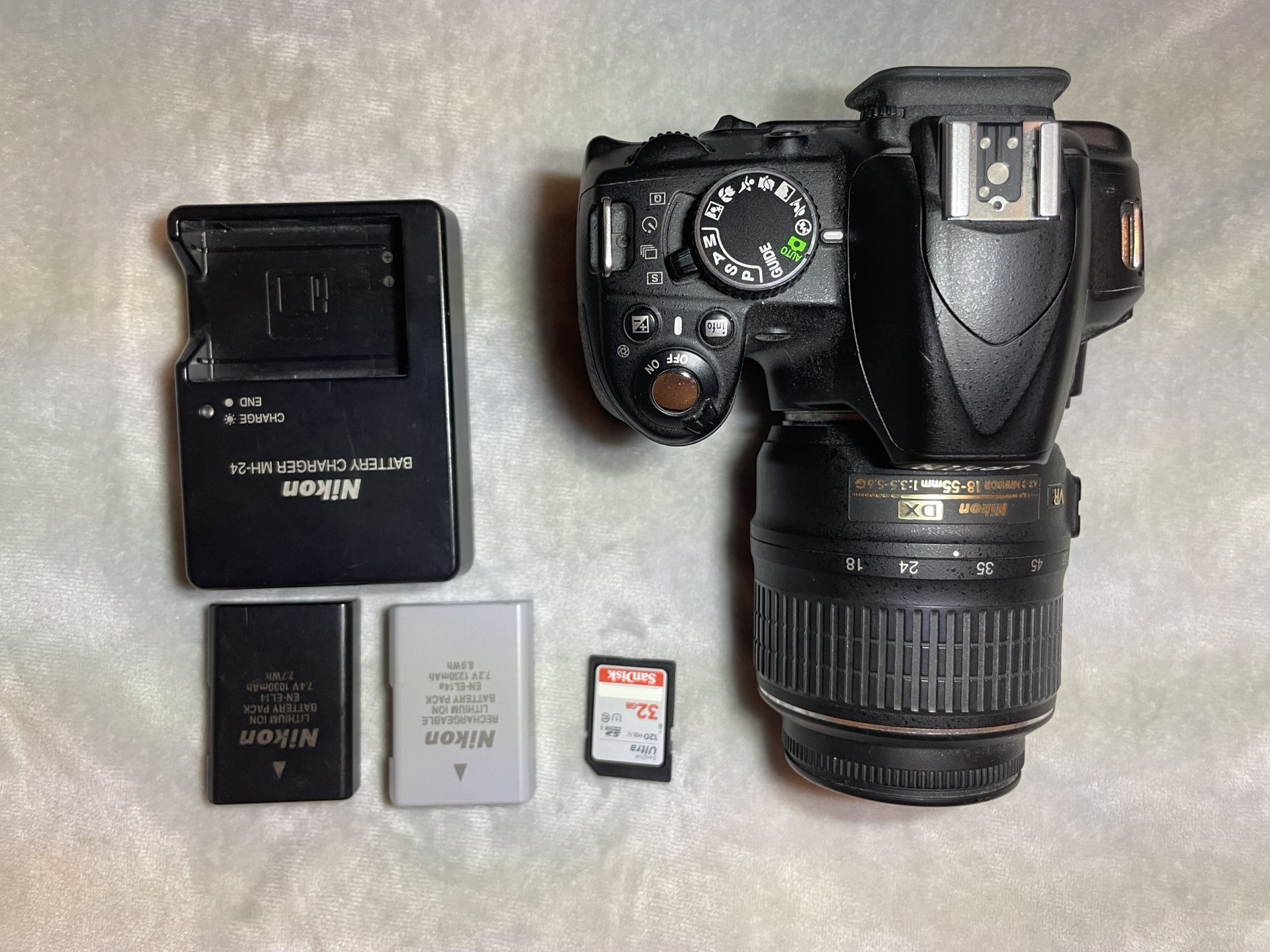 Nikon D3100 SLR w/ 18-55mm Lens + SD Card + Batteries + Charger