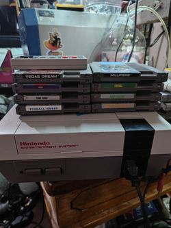 Nintendo NES console with games