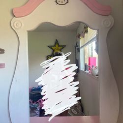 pink and white dresser with mirror and side table 