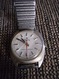 Vintage Orion Unbreakable Mainspring mechanical watch, a classic Swiss-made timepiece.
