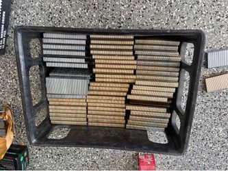Galvanized 16 gauge medium crown staples feature a 1/2-inch crown width and 1-3/4-inch length. This bulk lot includes numerous collated strips in silv