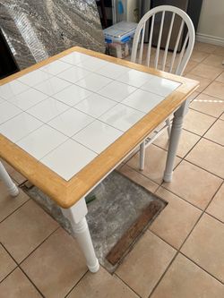 Square Tile Top Dining Table with two chairs