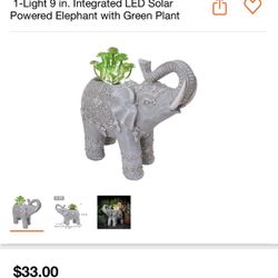 1-Light 9 in. Integrated LED Solar Powered Elephant with Green Plant