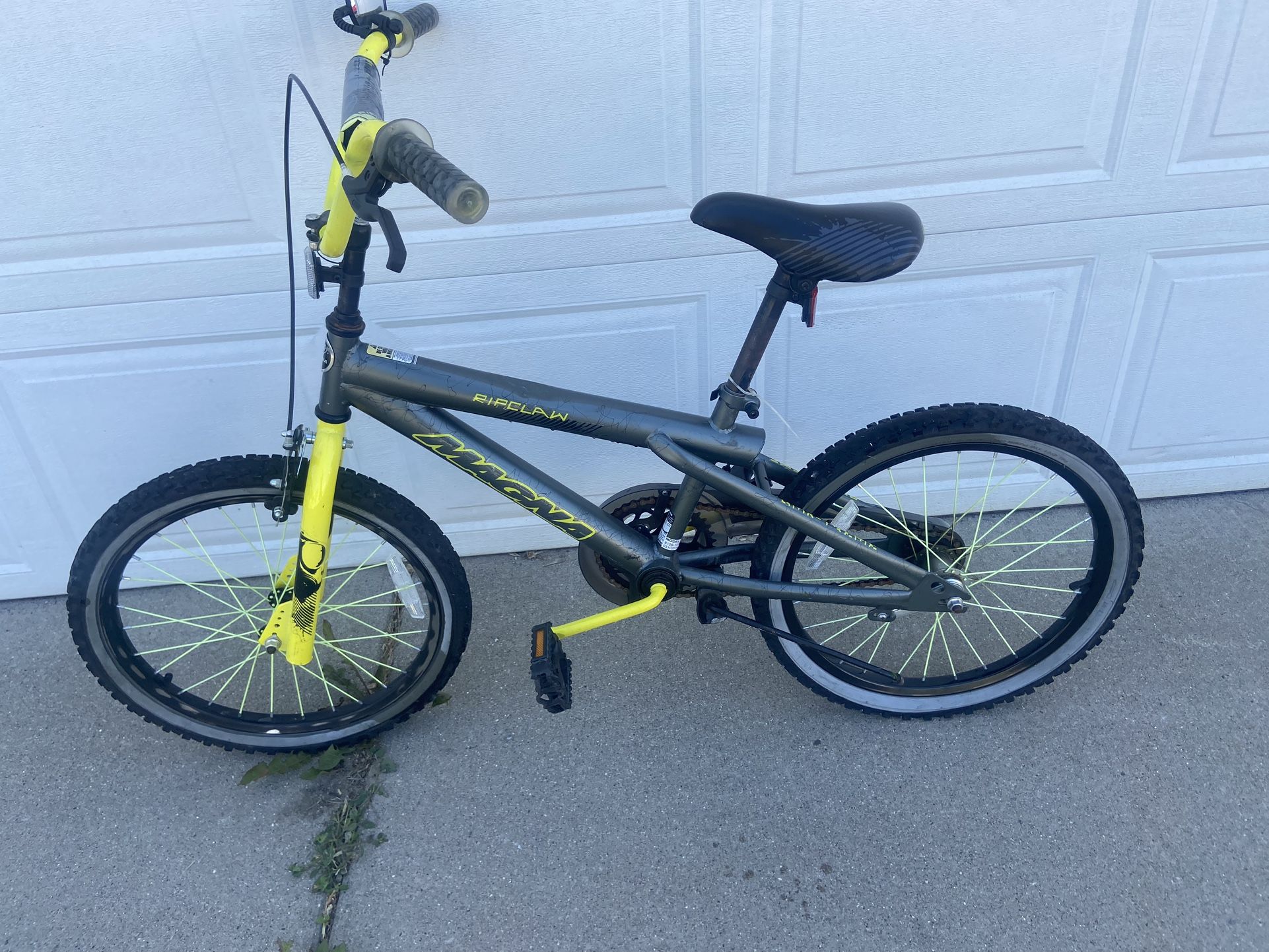 Green and grey 20" Magna rip claw bike.